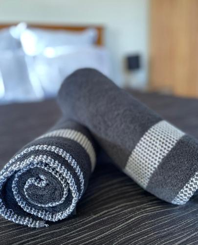 a black and gray tie sitting on a table at Colonial Motel in Twizel