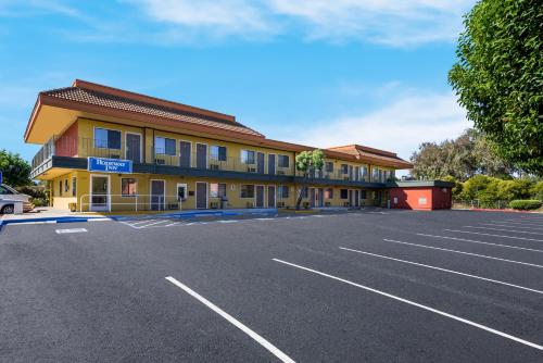 an empty parking lot in front of a hotel at Rodeway Inn Livermore in Livermore