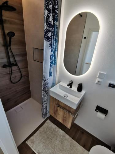 a bathroom with a sink and a mirror at Silent Hill House in Bleckede