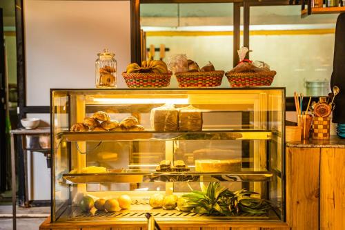 a display case filled with bread and other food at Kwabahal Boutique Hostel in Kathmandu