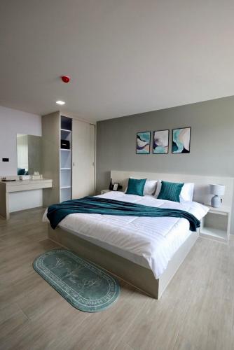 Aston Residence Hatyaiにあるベッド