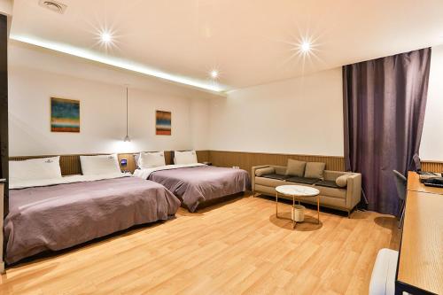 Ένα ή περισσότερα κρεβάτια σε δωμάτιο στο Brown Dot Hotel Jeonggwan