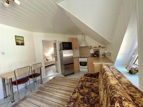 a kitchen with a large bed in a room at Nakvisa in Zarasai