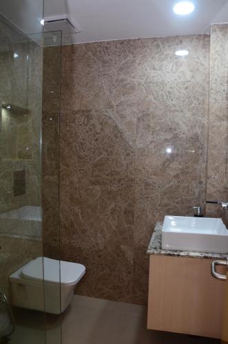a bathroom with a toilet and a sink and a shower at CRYTSAL RESIDENCY in Rānchī