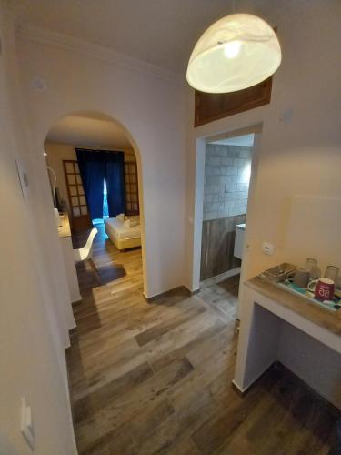a hallway with a living room with a fireplace at Bis Studios in Alikanas