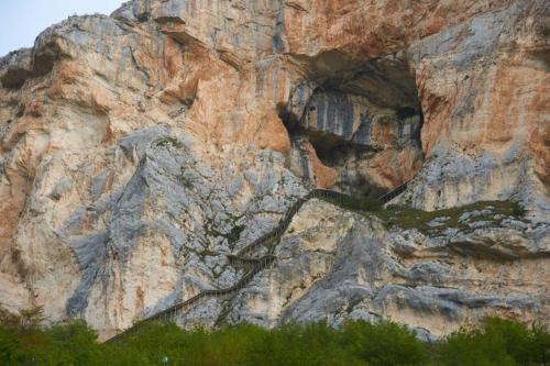 a rocky mountain with some green plants on it at La Villa dei Tartufi - B&B in Corfinio