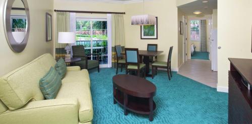 a living room with a couch and a table at Harbourside Resort, Paradise Island Bahamas in Nassau
