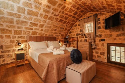 Medieval apartment Estiva tesisinde bir odada yatak veya yataklar