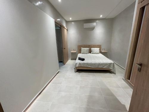Katil atau katil-katil dalam bilik di Villa 5 chambres route de Casablanca Marrakech