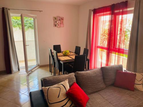 a living room with a couch and a table at PaFi Apartment in Dubrovnik