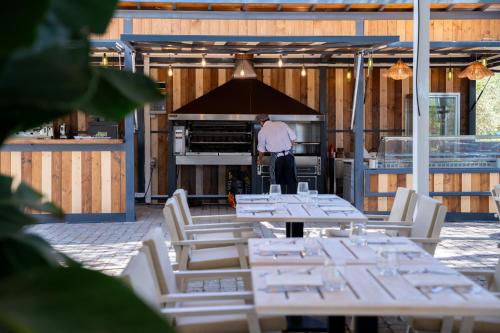 a man is standing in front of an oven at Villa Cesi Resort & Spa in Impruneta