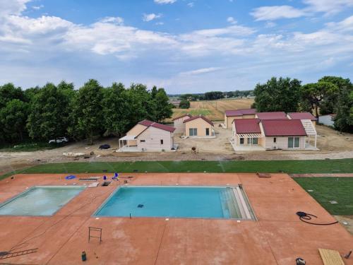 an overhead view of a house and a swimming pool at Incanto Glamping village in Savio di Ravenna
