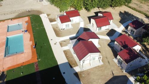 an overhead view of a group of houses with red roofs at Incanto Glamping village in Savio di Ravenna