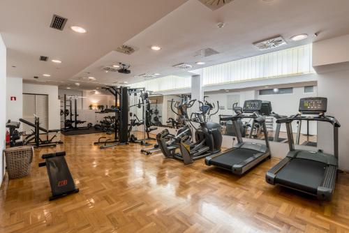 a gym with treadmills and elliptical machines at Annex building of Art Hotel in Split