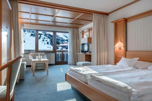 Postel nebo postele na pokoji v ubytování Hotel Alpina deluxe