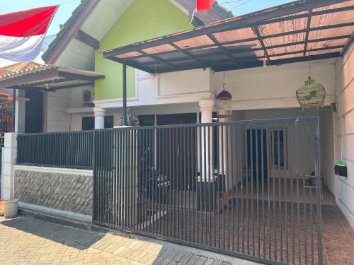 a house with a gate in front of it at Holiday Park 