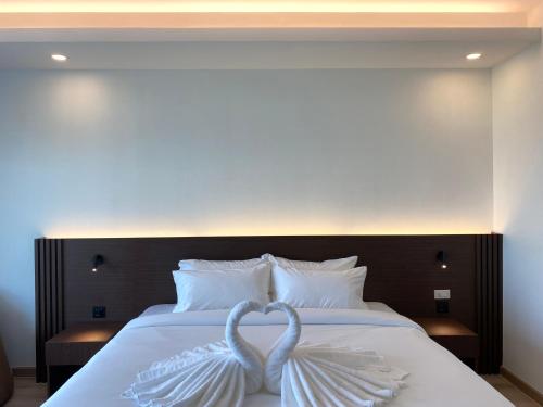 GEEN Hotel Chonburiにあるベッド