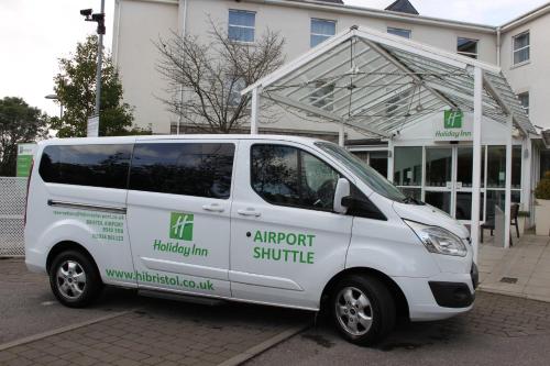 a white van parked in front of a building at Holiday Inn Bristol Airport by IHG in Redhill