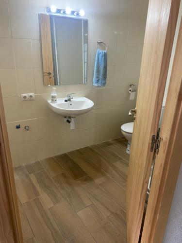 a bathroom with a sink and a toilet at Casa Casteller 1-4 huéspedes in Arfa