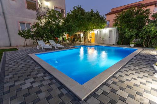 a swimming pool in the middle of a house at Apartman Blagaj in Blagaj