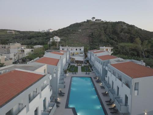 an aerial view of a resort with a swimming pool at Sunrise Village Hotel - All Inclusive in Plataniás