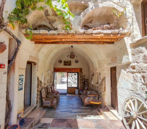 an entrance to a building with a stone wall at Vintage Cave House Hotel in Göreme