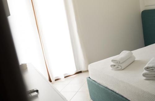 Ένα ή περισσότερα κρεβάτια σε δωμάτιο στο Grand View Suites Meteora