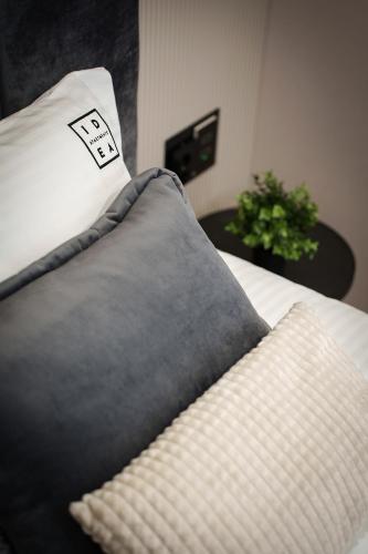 a close up of a pillow on a bed at IDEA LUX Apartmani Kragujevac in Kragujevac