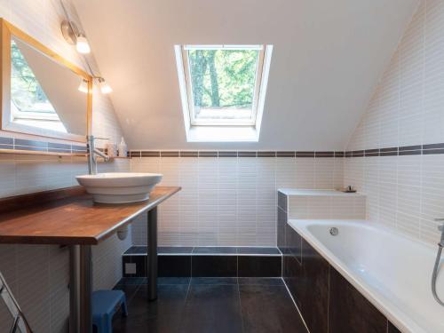 a bathroom with a sink and a bath tub at Maison Aragnouet, 5 pièces, 10 personnes - FR-1-296-343 in Aragnouet
