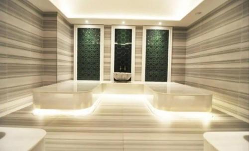 a large bathroom with two sinks and two windows at Live lavishly rent a luxury condo apartment with top-notch amenities in the 40+F in Istanbul
