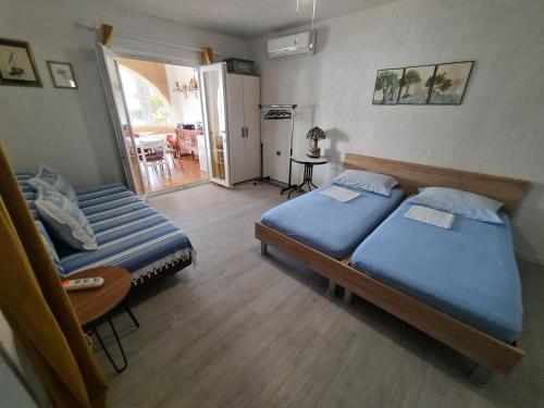 Postel nebo postele na pokoji v ubytování Apartments Ivan