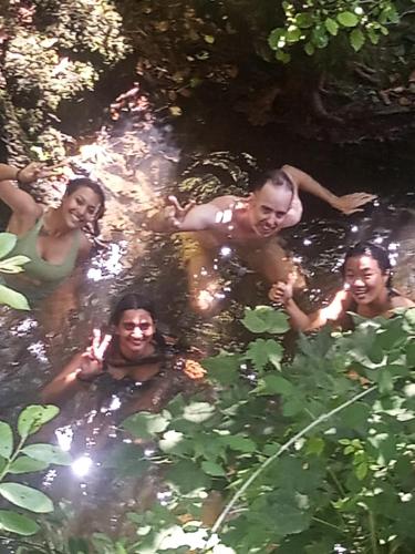 a group of people swimming in a river at Watermill Moinho Garcia in Pinheiro da Bemposta