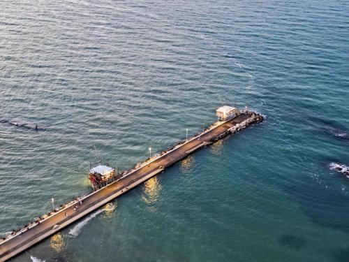 an aerial view of a pier in the water at B&B Palazzo Bruni - Dimora di Mare in Marina San Vito