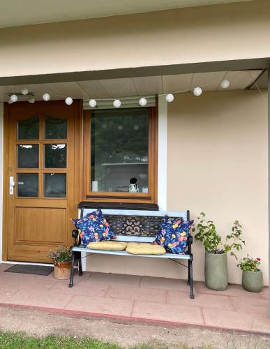 a bench sitting in front of a house at Apartment im Pfälzerwald in Lambrecht