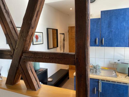 a kitchen with blue cabinets and a sink at Ferienwohnung Casa Conti Goslar in Goslar