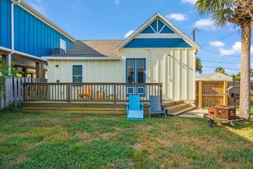 a house with a deck with a blue slide at Alister House in Port Aransas