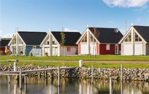 a row of houses next to a body of water at Amazing Home In Wandlitz With Sauna in Wandlitz