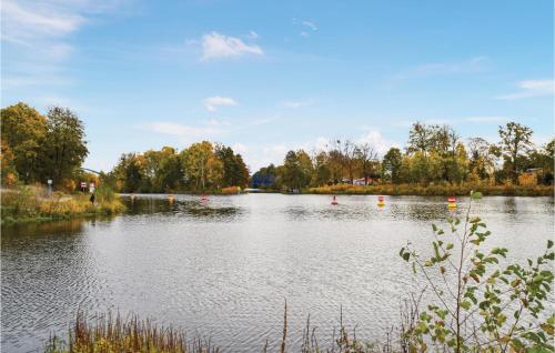 a large lake with red balls in the water at Amazing Home In Wandlitz With Sauna in Wandlitz
