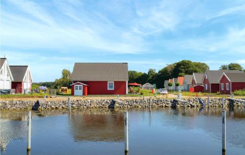 a row of houses next to a body of water at Amazing Home In Wandlitz With Sauna in Wandlitz