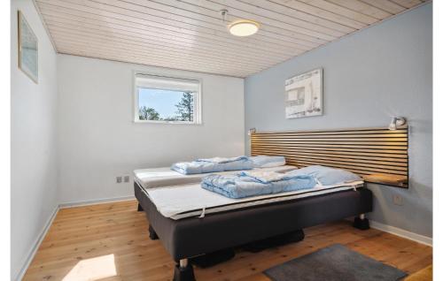 a bedroom with two beds in a room at Awesome Home In Haderslev With 2 Bedrooms And Wifi in Diernæs