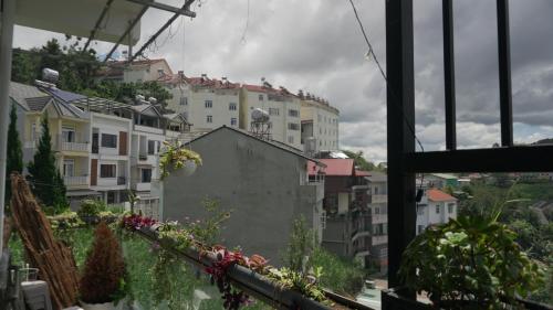 a view from a window of a city with buildings at Hoshi DaLat House in Da Lat