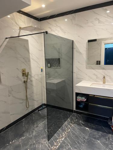 a bathroom with a shower and a sink at Modern huge double room with private bathroom in Colindale in Colindale