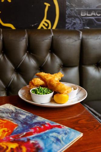 a plate of food on a table with some food at The Saddle Inn in Chester