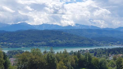 a view of a river with mountains in the background at Lakeside Hills - Classic Room in Krumpendorf am Wörthersee