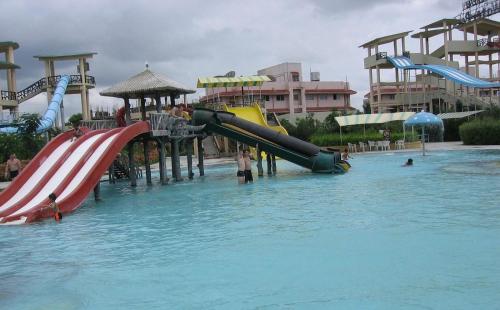 a water park with a slide in the water at SAI CELEBRATIONS INN SHIRDI in Shirdi