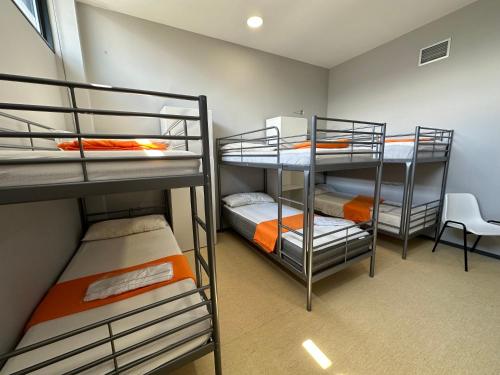 a room with three bunk beds in it at Vigo Beds & Rooms in Vigo