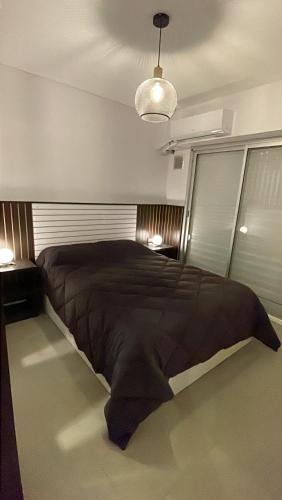 a bedroom with a large bed in a room at Dorrego in Rosario