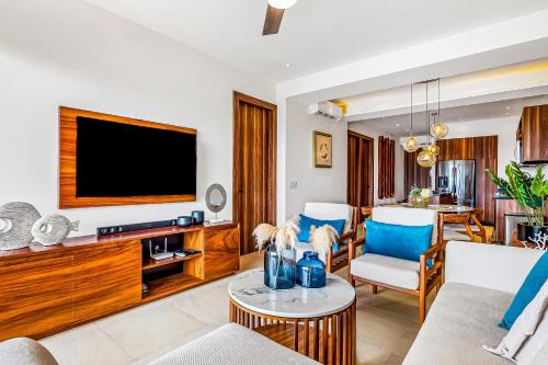 a living room with a tv and a couch at D'Toscana Residencial # 305 in Nuevo Vallarta 