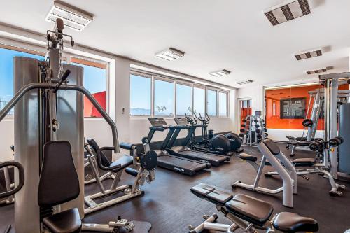 a gym with several treadmills and cardio machines at D'Toscana Residencial # 305 in Nuevo Vallarta 