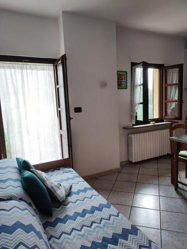 Postel nebo postele na pokoji v ubytování Casa vacanze a Macra